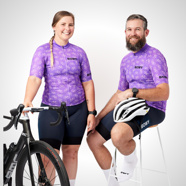 Man and Woman in Purple Tiny Bikes Jersey front with bike and helmet