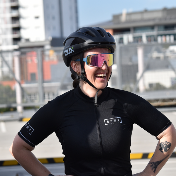 Women in Midnight Black Cycling Jersey front shot outdoors laughing